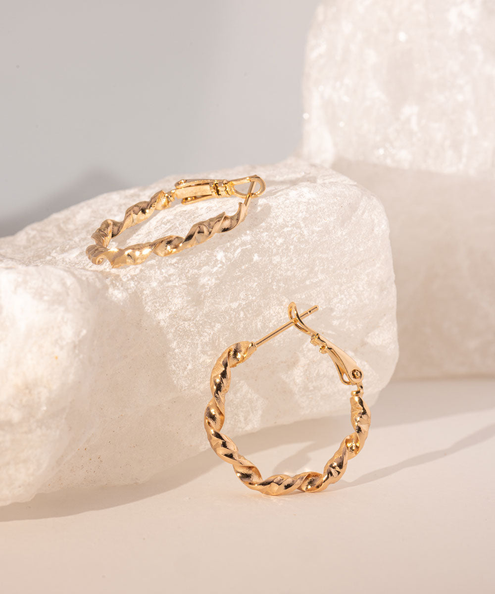 Argollas Entorchadas Rosé | acero inoxidable | baño de oro rosa 18k | Mellany Joyas